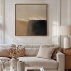 A modern living room featuring a beige sofa, neutral cushions, a wooden side table with white lamp, dried flowers in a vase, and the Earthy Cliffs Abstract Canvas Art. Natural light enhances this cozy décor in earthy tones.