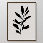 Ebony Leaf Canvas Art showcases a black leafy plant silhouette on a light beige background in a thin dark frame—perfect minimalist decor to add bold contrast and organic style to any modern interior.