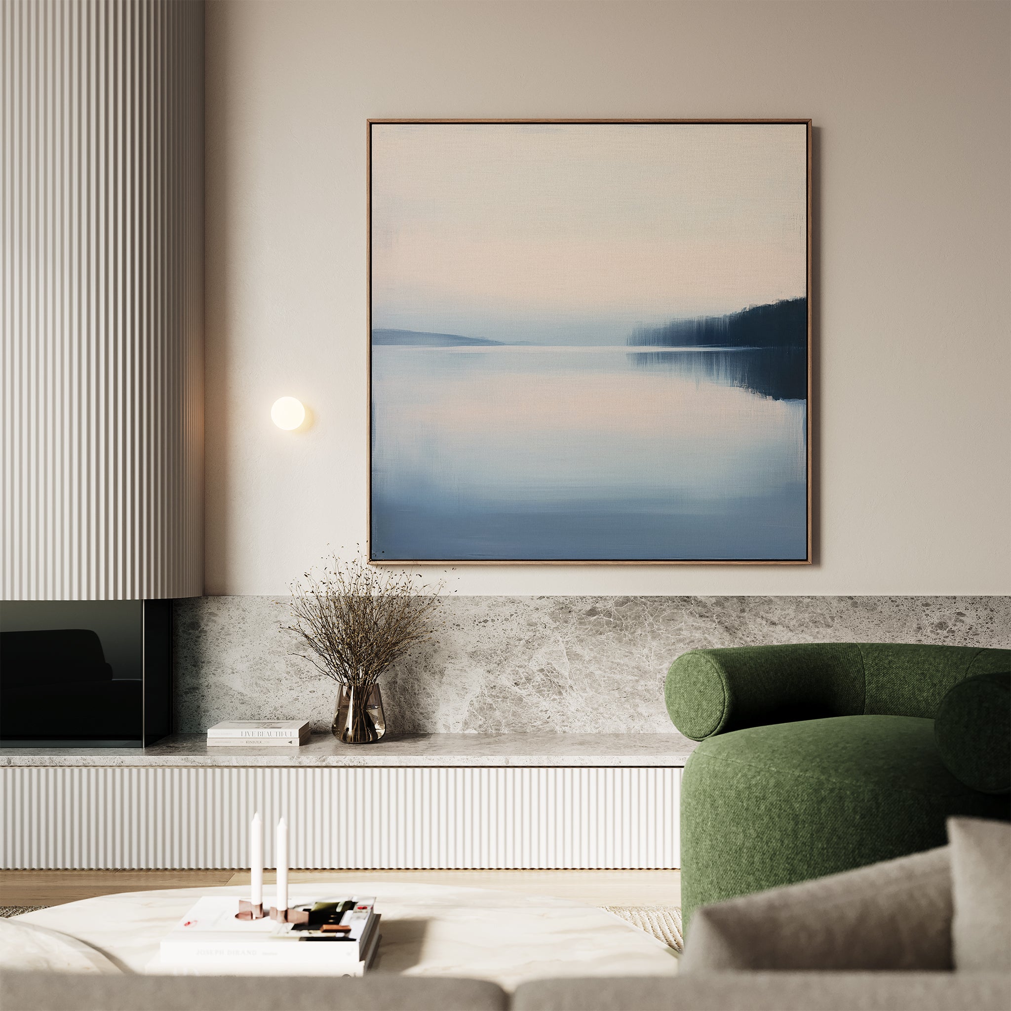 A modern living room features a green curved armchair, marble-topped shelf, dried branch vase, and the Echo Lake Canvas Art—a large framed painting in blue and pink tones—that brings minimalist charm above.