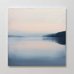 Echo Lake Canvas Art depicts a tranquil lake at dawn or dusk with pastel hues, distant hills, and mirrored water—ideal minimalist wall art for peaceful bedroom decor and a calming atmosphere.