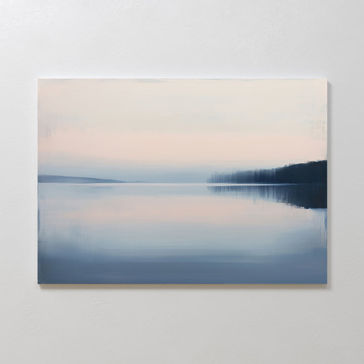 The Echo Lake Canvas Art – Horizontal features a tranquil dawn lake scene in soft pastel blues and pinks with a hazy shoreline—ideal serene wall art to enhance calming bedroom decor.