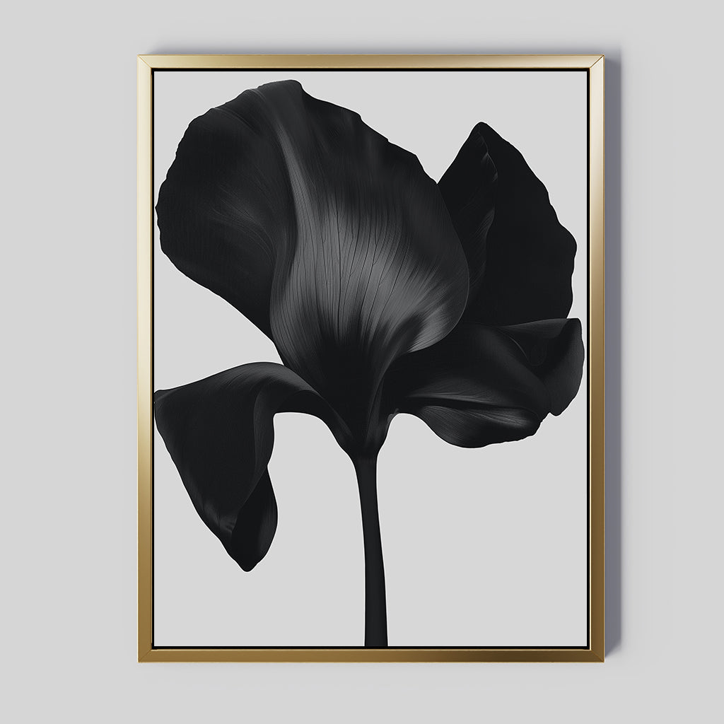 The Eclipse Bloom Canvas Art features a black flower with large textured petals on a light gray background, set in a sleek gold frame—ideal modern wall art to enhance your living room decor.