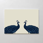 Elegant Plumage Canvas Art showcases two dark blue peacocks with detailed tails, facing each other on a light beige background—perfect symmetrical wall art for elevating chic living room decor.