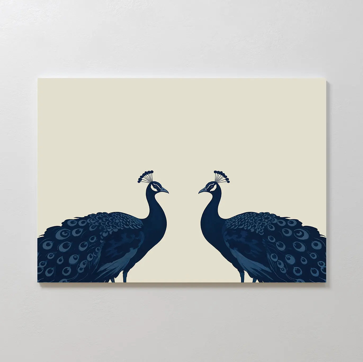 Elegant Plumage Canvas Art showcases two dark blue peacocks with detailed tails, facing each other on a light beige background—perfect symmetrical wall art for elevating chic living room decor.