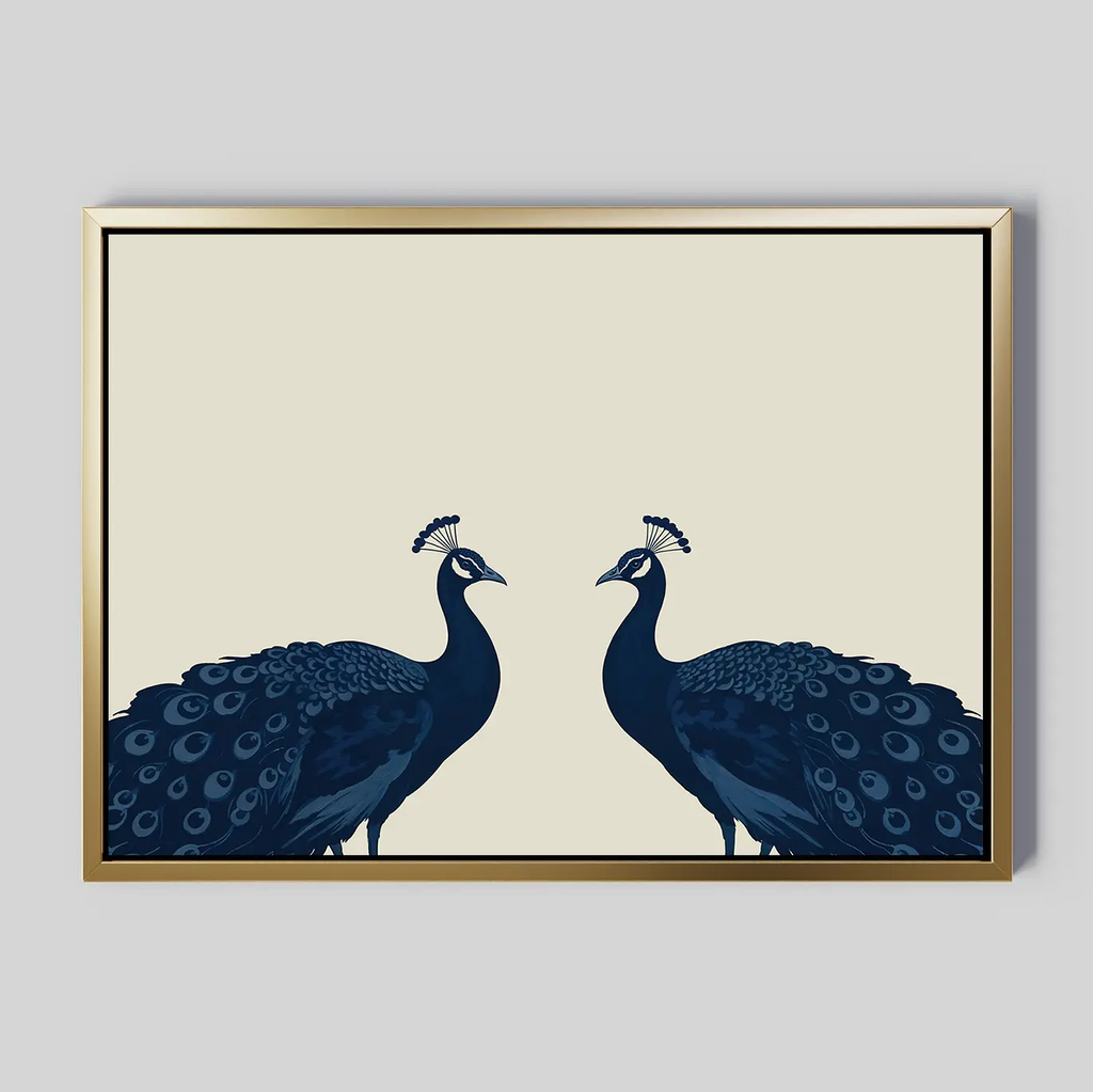 Elegant Plumage Canvas Art: A minimalist framed canvas featuring two stylized blue peacocks with raised crests on a beige background, bordered by a slim gold frame—ideal for adding sophistication to your living room decor.