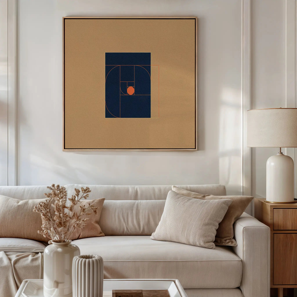 A beige sofa with neutral pillows sits below the Ember Point Canvas Art, paired with a wooden side table, white lamp, and a vase of dried flowers for perfect modern living room decor.