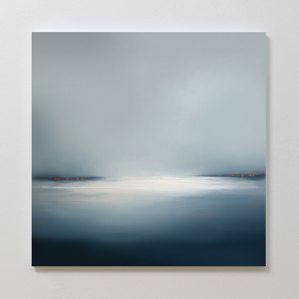 The Emberline Stillness Canvas Art features a misty blue-gray landscape with a glowing center and orange horizon lights—perfect minimalist wall art to bring calmness and serenity to modern interiors or bedroom decor.