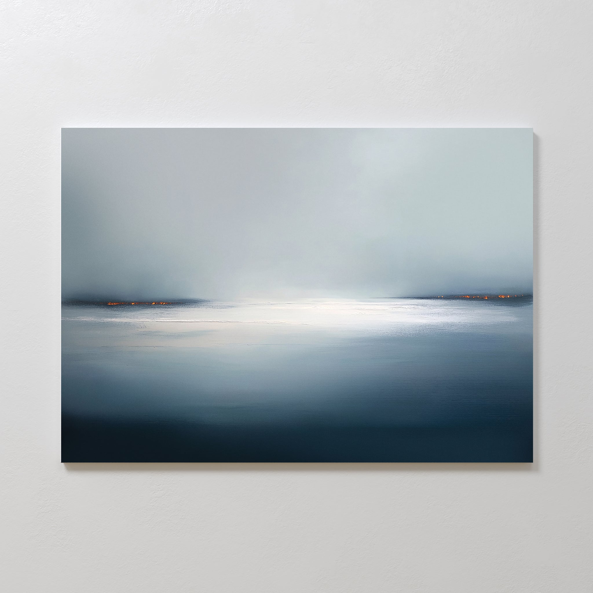 Emberline Stillness Canvas Art – Horizontal features a minimalist, tranquil seascape with a misty sky, calm blue-gray water, and subtle orange horizon lights—ideal for adding serenity to modern interiors.