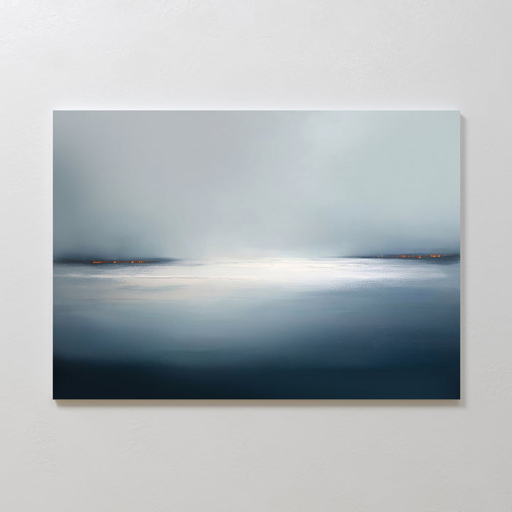 Emberline Stillness Canvas Art – Horizontal features a minimalist, tranquil seascape with a misty sky, calm blue-gray water, and subtle orange horizon lights—ideal for adding serenity to modern interiors.