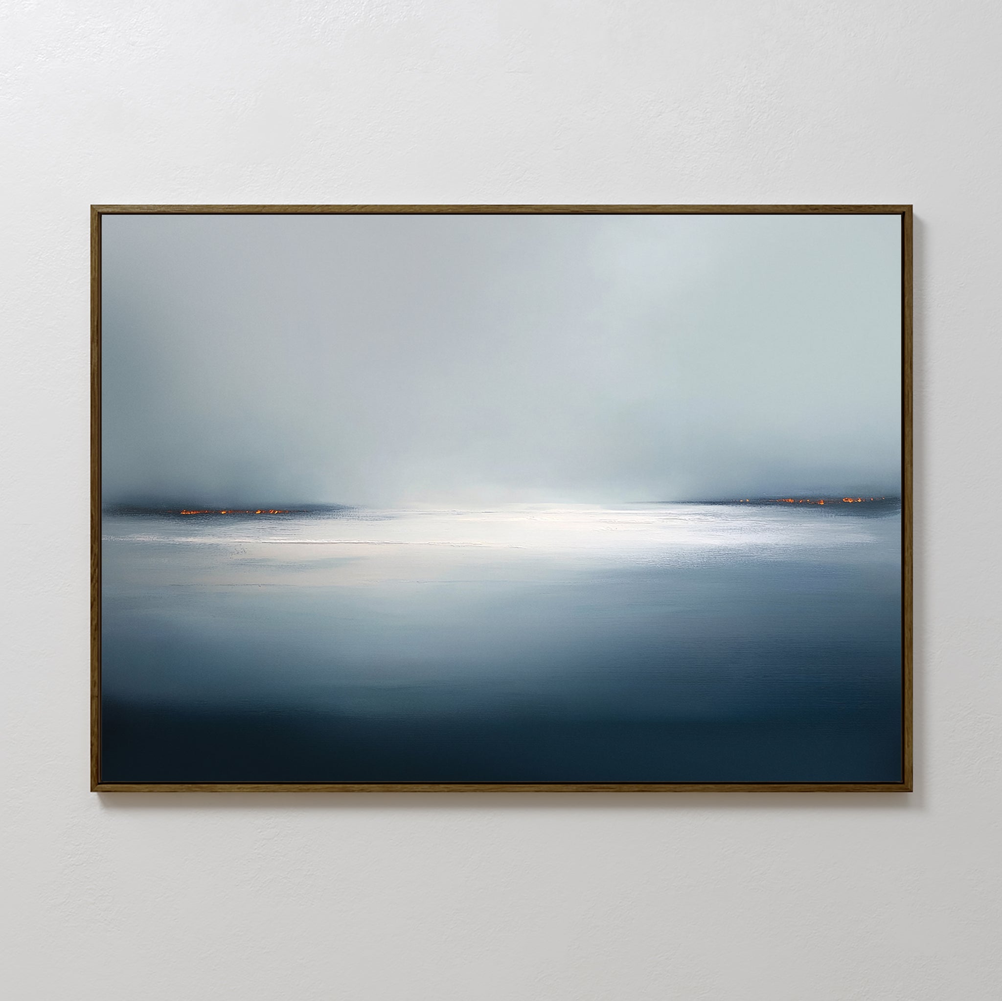 The Emberline Stillness Canvas Art – Horizontal features a calm, misty seascape in soft blue and gray tones with bright horizon and orange shoreline lights—perfect minimalist wall art for modern interiors.