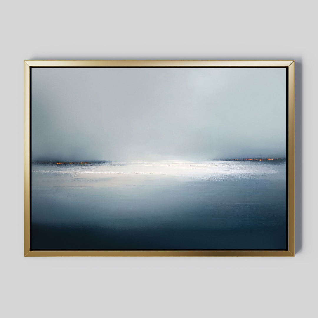 The Emberline Stillness Canvas Art – Horizontal features a calm, misty seascape in a gold frame—ideal minimalist wall art for modern interiors seeking tranquility and serene ambiance.
