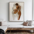 A minimalist living room with a wooden bench, cream and beige cushions, and the Embrace Abstract Canvas Art—a large painting of two overlapping human figures in neutral earth tones—creates timeless living room decor.