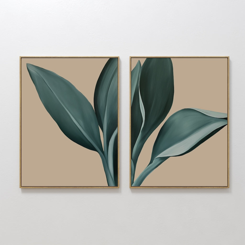 The Emerald Poise Set of 2 features framed botanical prints with large green leaves on a beige background, displayed side by side. This minimalist wall art is ideal for living room decor and showcases modern, stylized leaf designs.