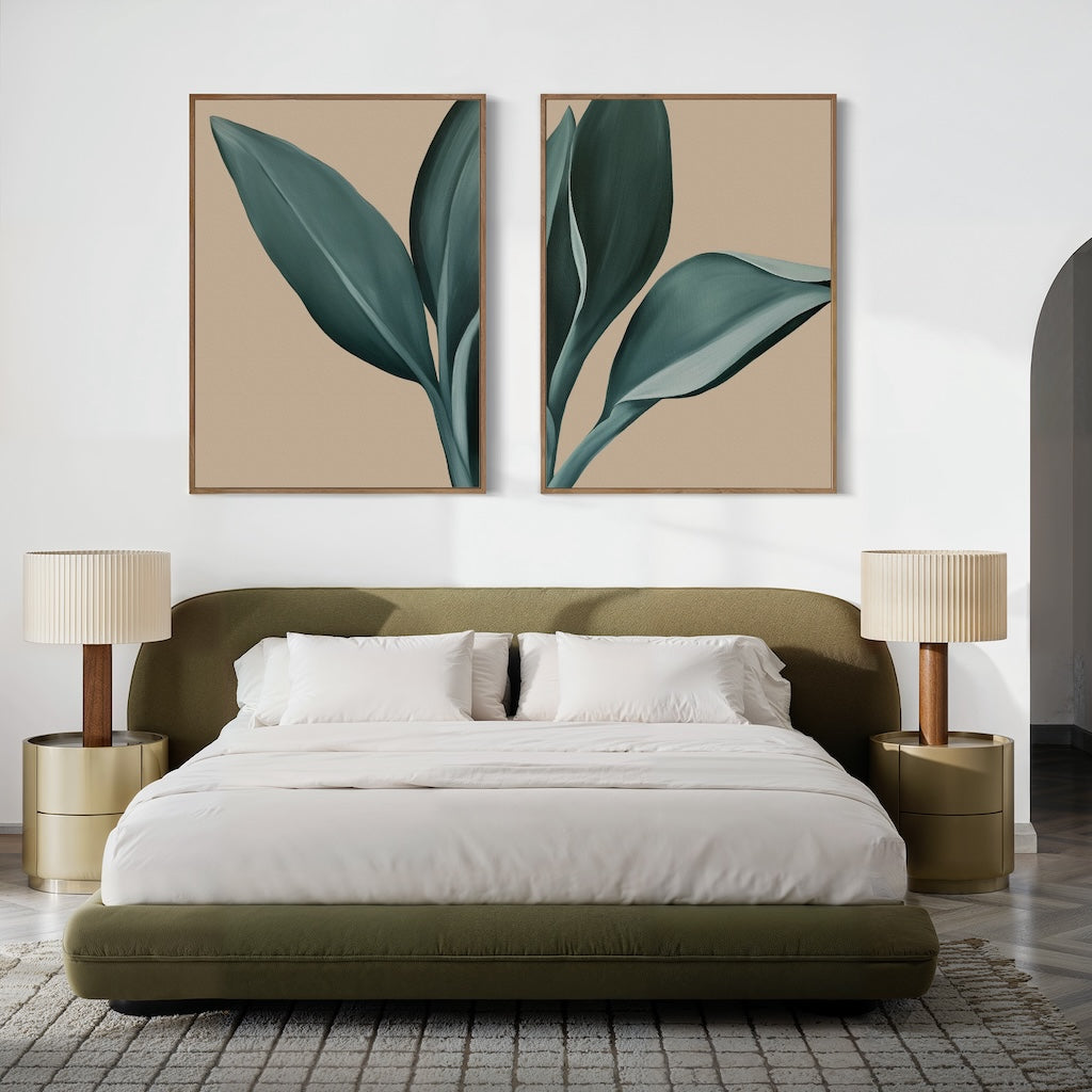 Modern bedroom with an olive-green upholstered bed, white bedding, and two beige nightstands topped with the Emerald Poise Set of 2 lamps. Green leaves wall art hangs above the headboard, while neutral walls and a textured rug complete this serene space.
