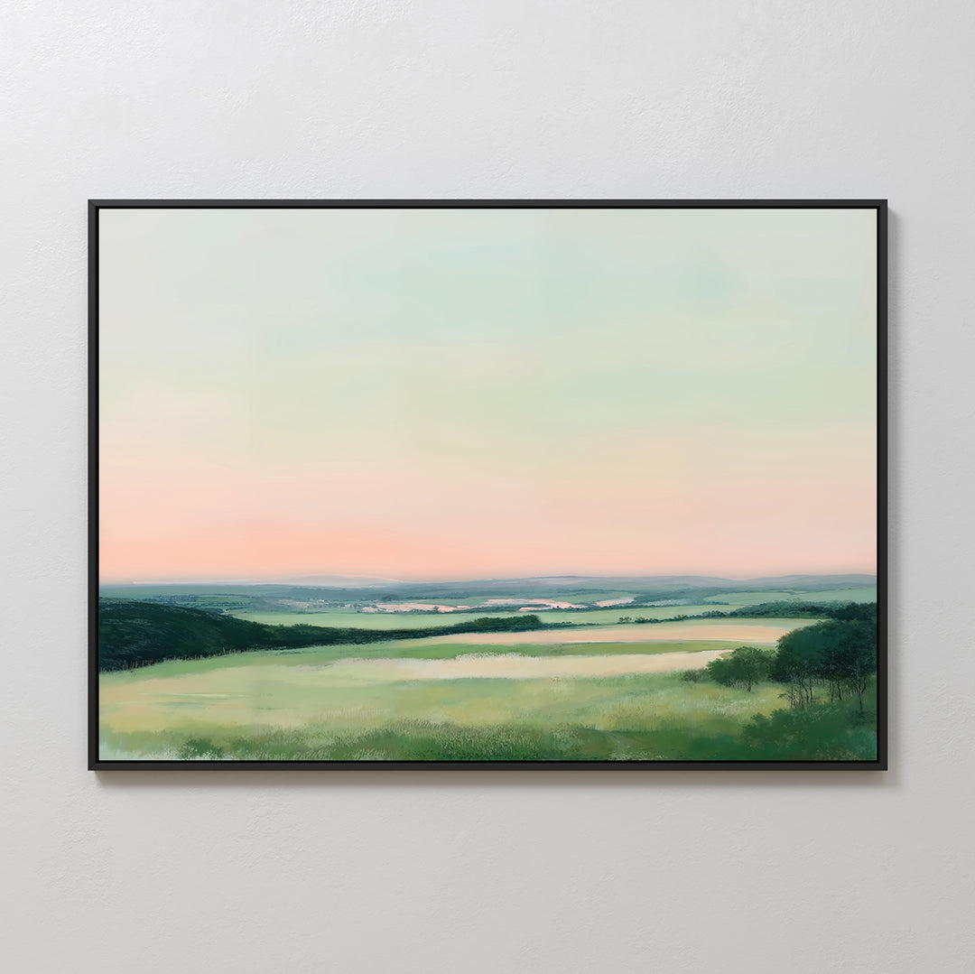 The Evening Hues Canvas Art – Horizontal showcases green fields, distant hills, and a pastel pink and blue sky, adding tranquil decor to your living room’s white wall.