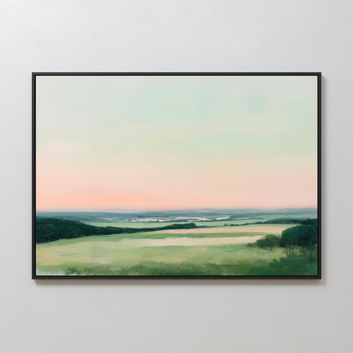 The Evening Hues Canvas Art – Horizontal showcases green fields, distant hills, and a pastel pink and blue sky, adding tranquil decor to your living room’s white wall.