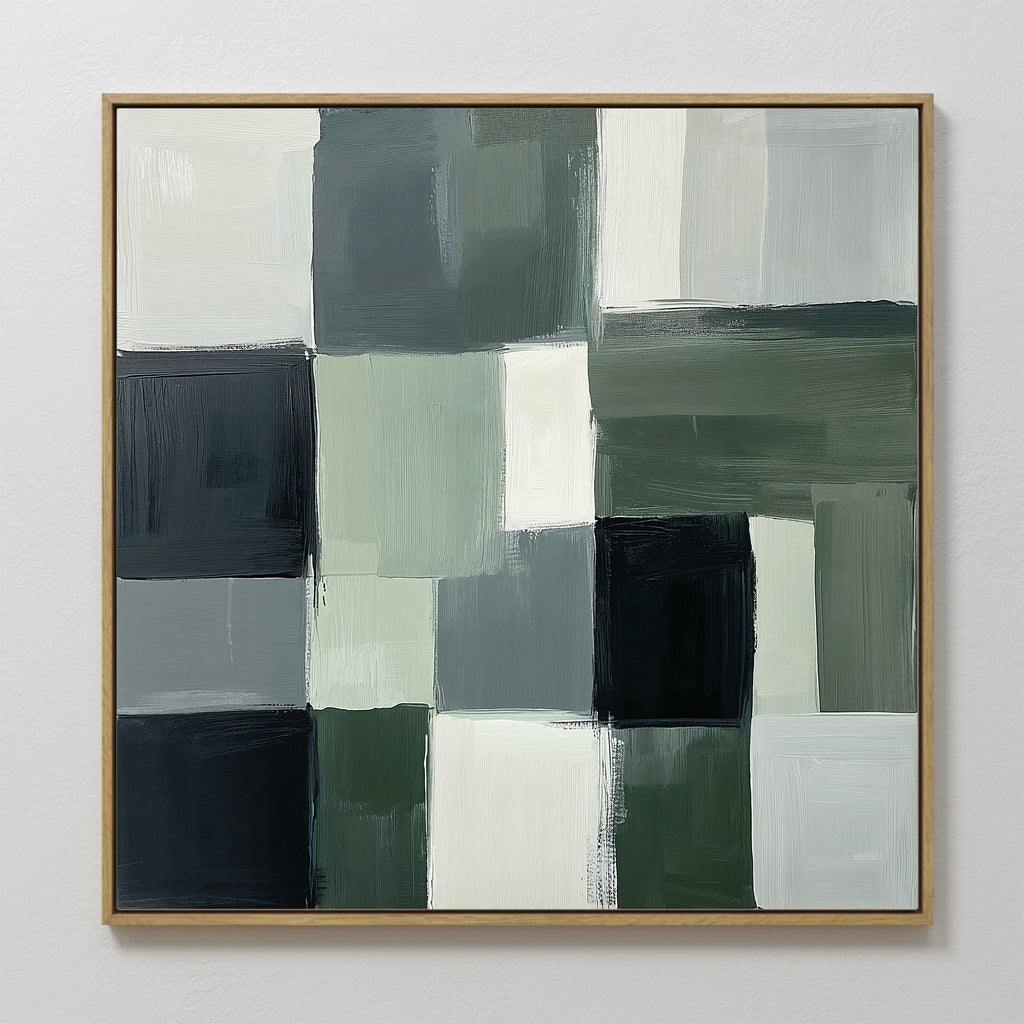 The Evergreen Abstract Canvas Art features a grid of overlapping rectangles in muted green, black, gray, and white with visible brushstrokes and uneven edges. Framed in simple wood, it’s perfect modern wall art for any space.