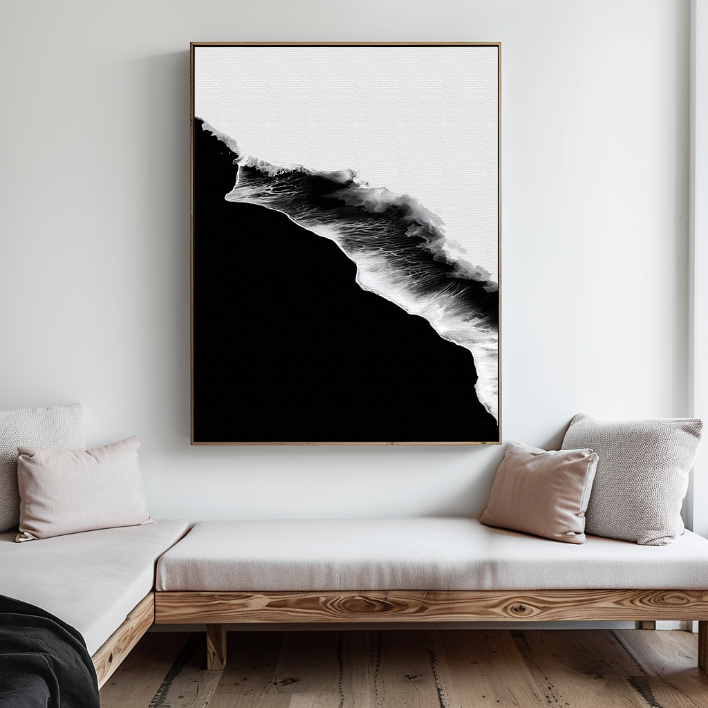 A minimalist living room with light wood furniture, white cushions, and the Black Ocean Abstract Canvas Art featuring an abstract wave design hanging above the sofa.
