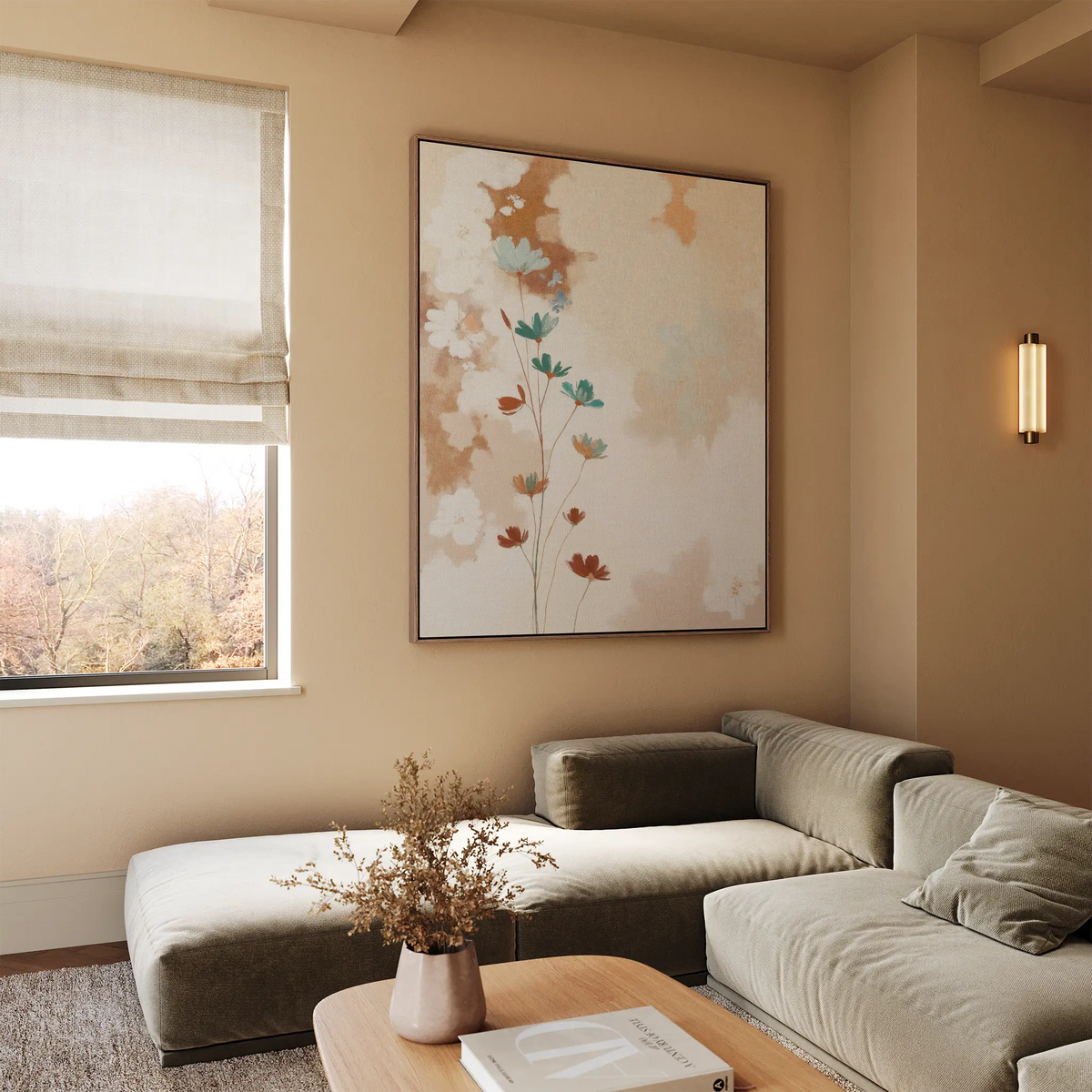 A modern living room with a light beige sectional, wooden coffee table with dried flowers, vintage-inspired decor, a Faded Flora Canvas Art on the wall, and a window framing views of autumn trees outside.