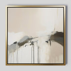 The Faded Memory Canvas Art features beige, white, and black abstract brushstrokes with dripped paint, elegantly framed in gold. Its large size and soft, dynamic lines make it ideal for minimalist living room decor.