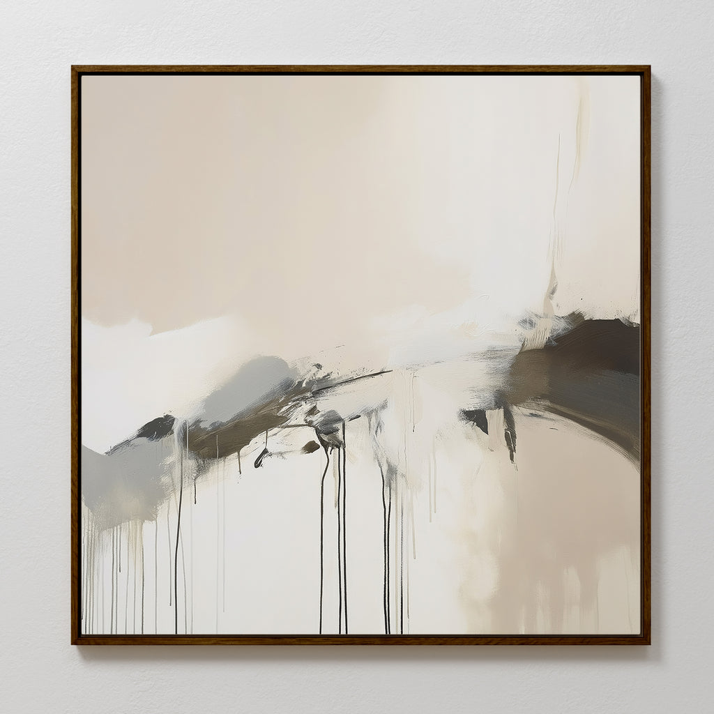 The Faded Memory Canvas Art features abstract paint drips in soft beige, white, gray, and black tones. This large piece is framed in a thin, dark wood frame and is perfect for display on a light-colored wall.