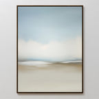 The Faded Silence Canvas Art features soft, blurred blue, white, and beige tones that evoke a serene landscape or sky—perfect for adding modern style to a white wall.