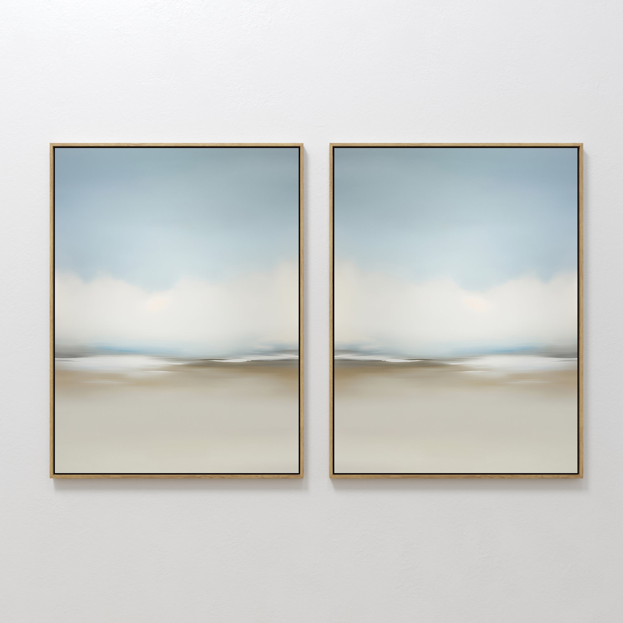 The Faded Silence Set of 2 features large, minimalist wall art with soft, blurred tones of blue, beige, and white, evoking a tranquil abstract landscape—perfect modern decor for a serene, stylish space.