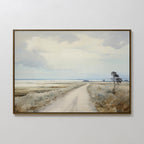 Far Light Canvas Art features a serene rural landscape with a dirt road, grassy fields, and trees beneath a cloudy sky. Its muted tones make it an ideal choice for minimalist home decor.