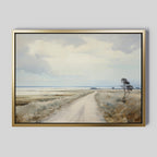 Far Light Canvas Art: A framed painting of a rural landscape with a dirt road, grassy fields, sparse trees, and a broad cloudy sky—an ideal choice for minimalist decor in any space.