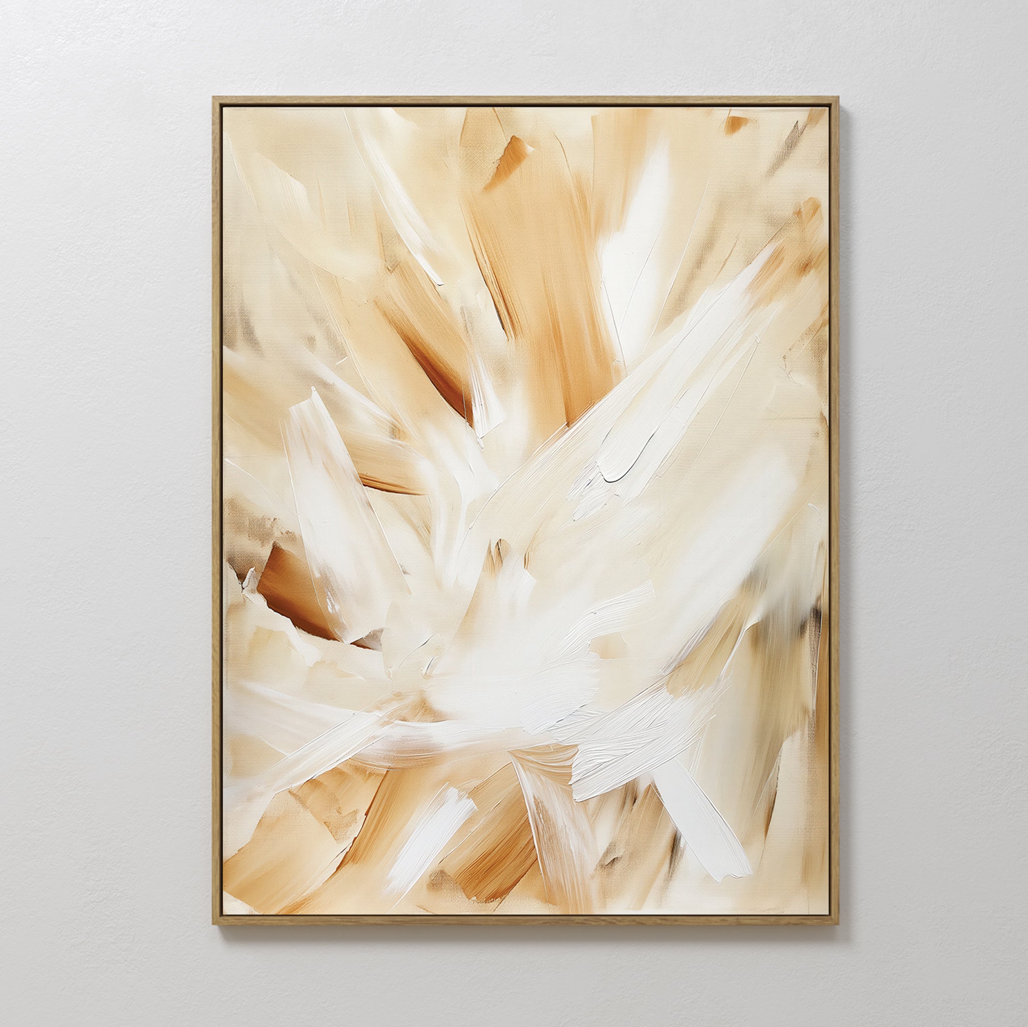 The Feathered Touch Abstract Canvas Art features broad, sweeping brushstrokes in beige, cream, and white for a soft, textured look. This framed wall art print adds elegance to your home decor and is shown on a plain light-colored wall.