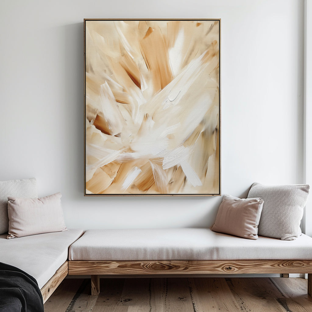 A minimalist living room with a light wooden daybed, neutral cushions, and the Feathered Touch Abstract Canvas Art in beige, white, and tan tones displayed on a white wall.