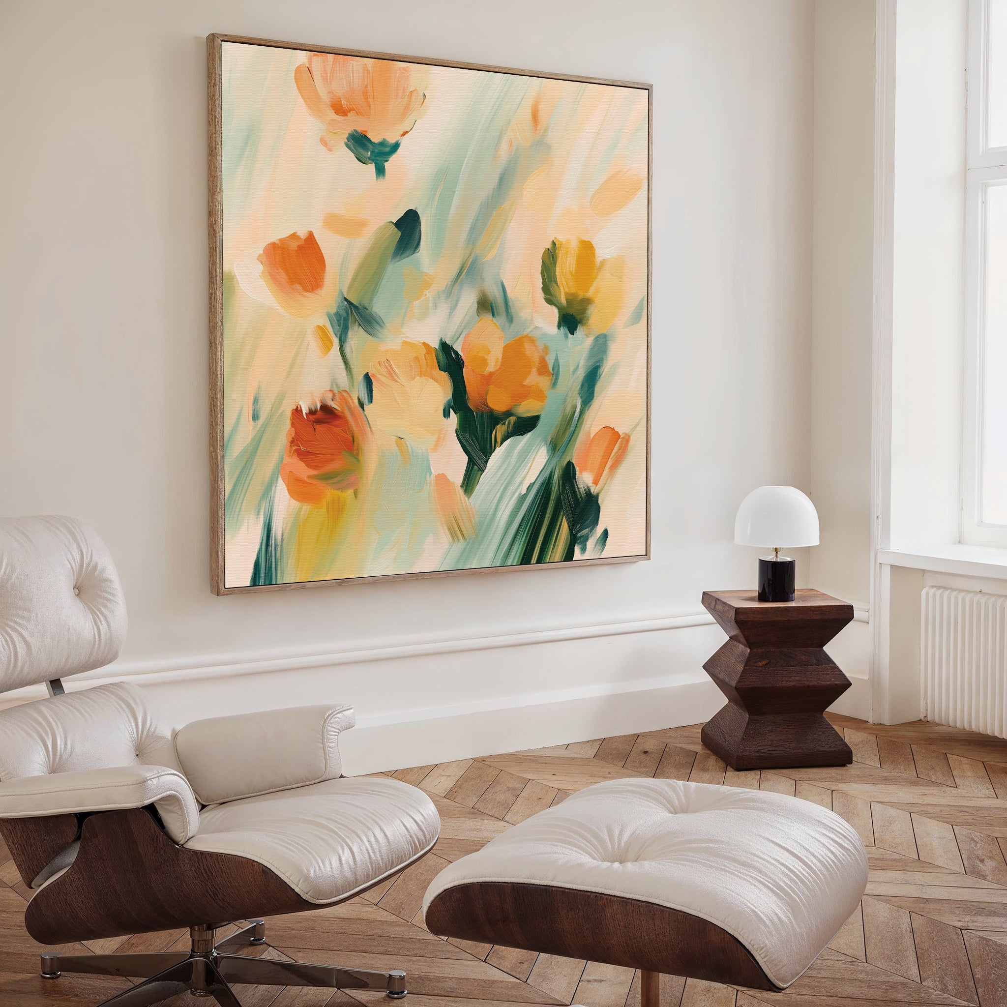A modern living room features the Field Of Gold Canvas Art, a white leather lounge chair with ottoman, wooden side table, and small white lamp by the window—perfect for those who appreciate stylish modern decor.