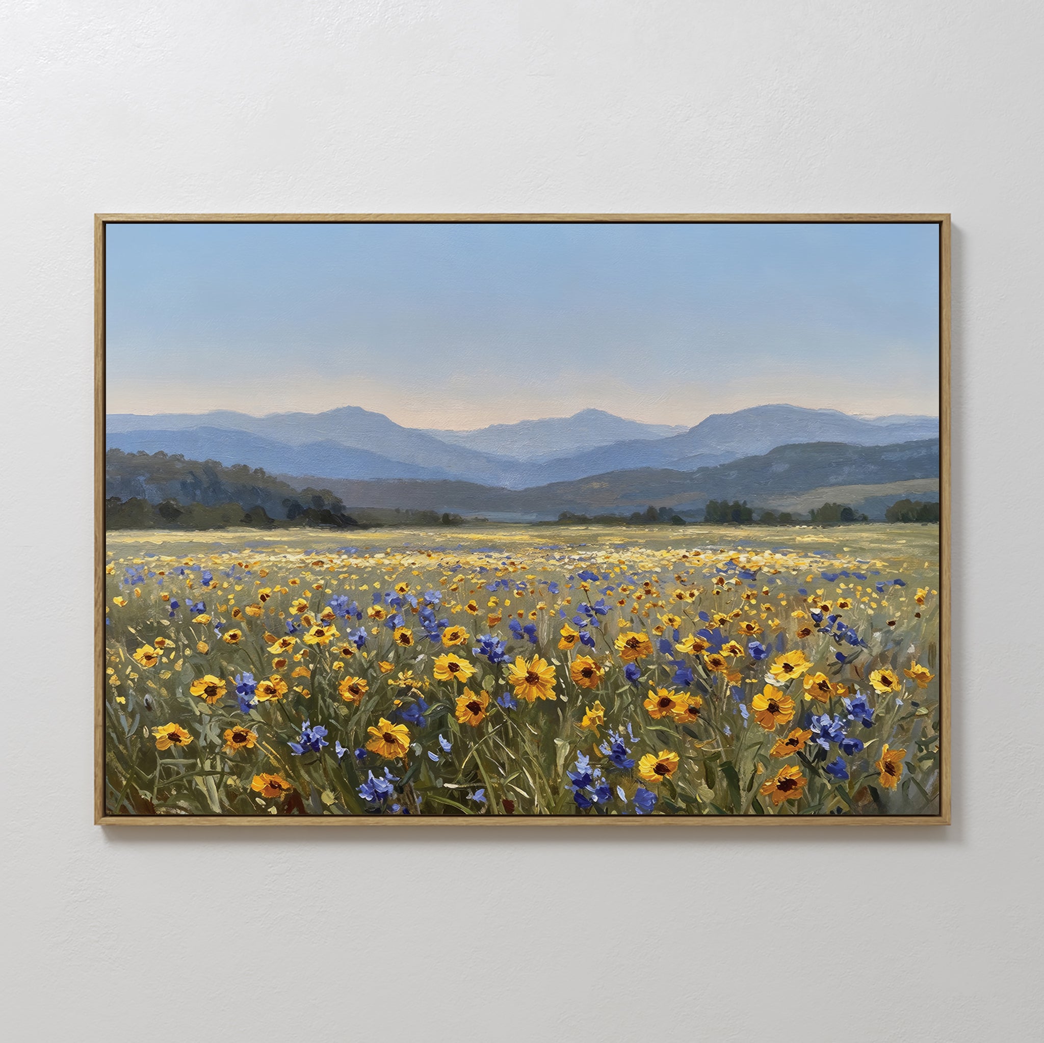 Add modern style to any space with the Fields of Color Canvas Art, featuring a vibrant field of yellow and purple wildflowers, distant green hills, and blue mountains beneath a clear sky. Framed for a stunning home decor accent.