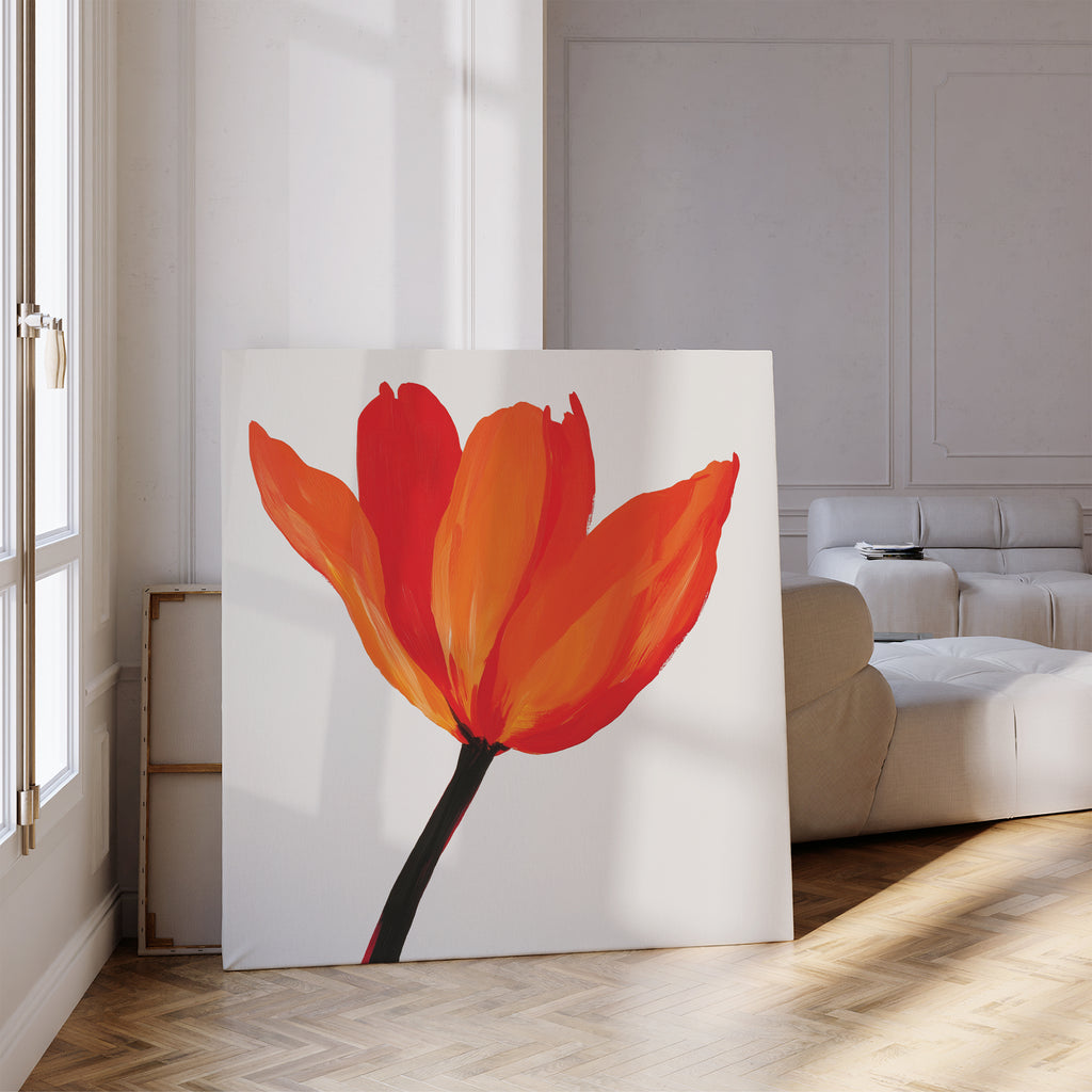 The Flame Tulip Canvas Art, featuring vivid red and orange petals with a dark stem, adds minimalist floral decor to a modern living room, ideal beside a white sofa and sunlit windows.
