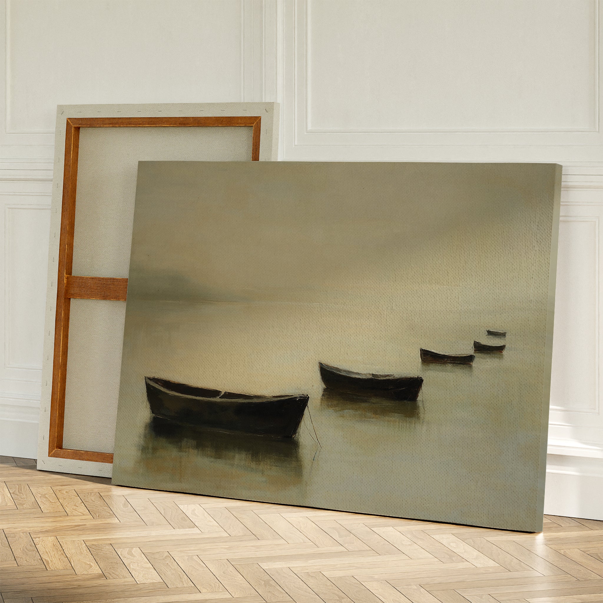 Floating Dreams Canvas Art features four small boats on calm water, leaning against a wall beside a blank canvas on a wooden herringbone floor—ideal for serene decor inspired by Nordic Park tranquility.