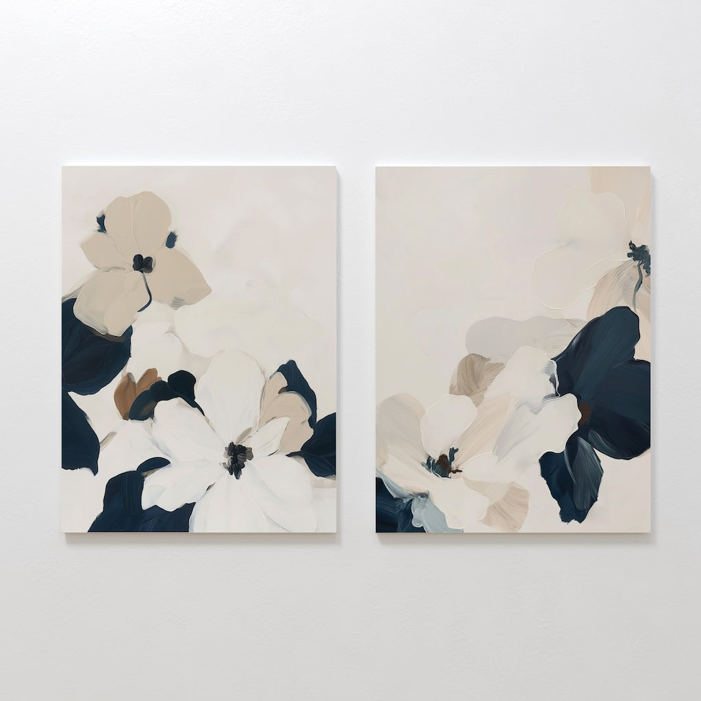 The Floral Serenity Set of 2 features abstract floral wall art in soft white, beige, taupe, and navy blue tones. Large overlapping petals create a minimalist look—ideal for elegant living room decor. Each canvas hangs beautifully side by side.