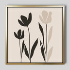 Floral Simplicity Canvas Art features three abstract tulips with black and beige petals on a light beige background, framed in gold. This modern canvas print blends clean lines and pairs beautifully with vintage-inspired decor.