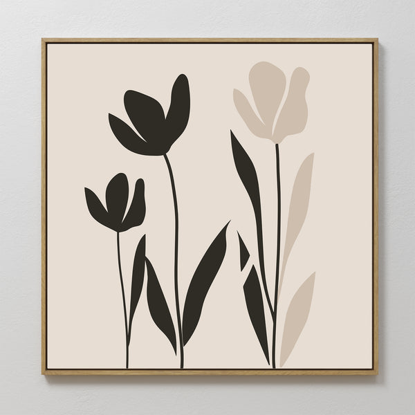 Floral Simplicity Canvas Art showcases three tulips—two black, one beige—with slender stems and leaves on a light background in a slim wooden frame, making it ideal for vintage-inspired minimalist decor.