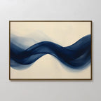 Flowing Indigo Canvas Art features wave-like shapes in deep blue on a light beige background, framed with a dark border—ideal modern wall art to elevate minimalist interiors or enhance your living room decor.