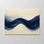 Flowing Indigo Canvas Art features a smooth, dark blue wave on a light beige background—modern wall decor that adds movement and fluidity. Ideal for minimalist interiors or as a striking accent in your living room.