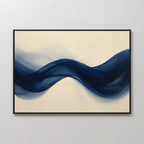 Flowing Indigo Canvas Art features bold, S-shaped blue waves on a light beige background and comes framed in black—an ideal modern wall art piece to elevate any minimalist space.