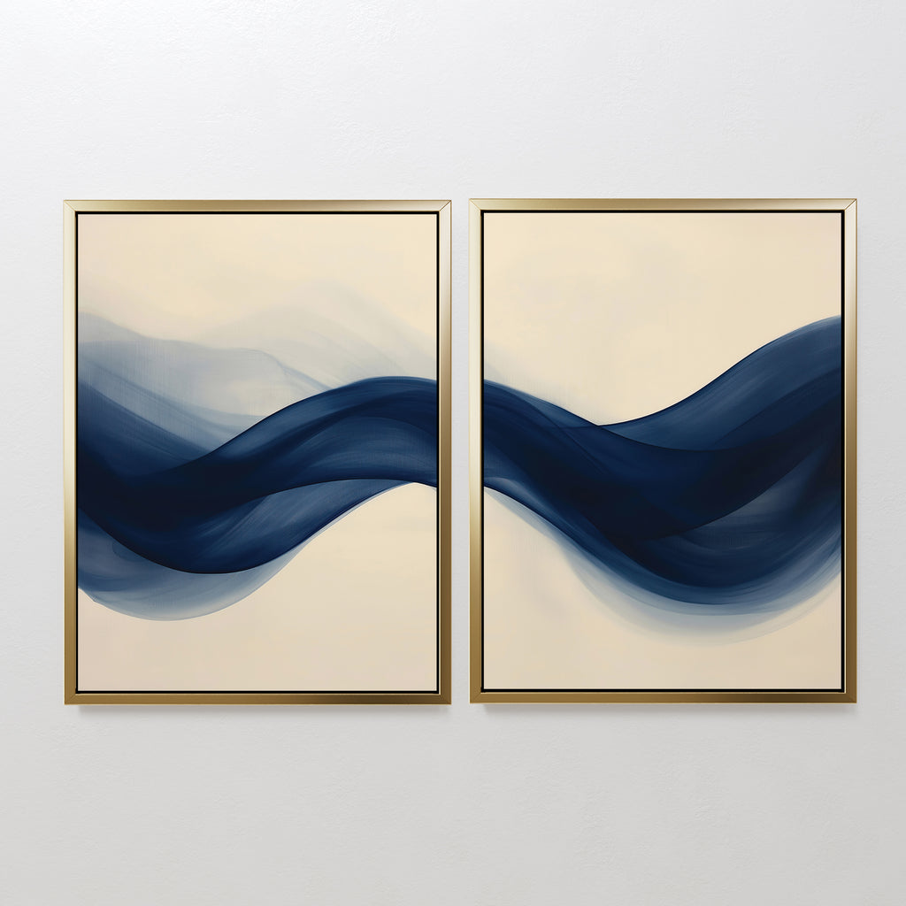 The Flowing Indigo Set of 2 features framed abstract paintings with dark blue, wave-like shapes on cream backgrounds—stylish wall art that adds movement and harmony to minimalist living room decor.