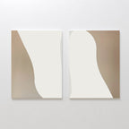 The Flowing Silhouettes Set of 2 features abstract paintings with smooth, flowing shapes in beige and off-white, hanging side by side—ideal modern wall art for minimalist living room decor.