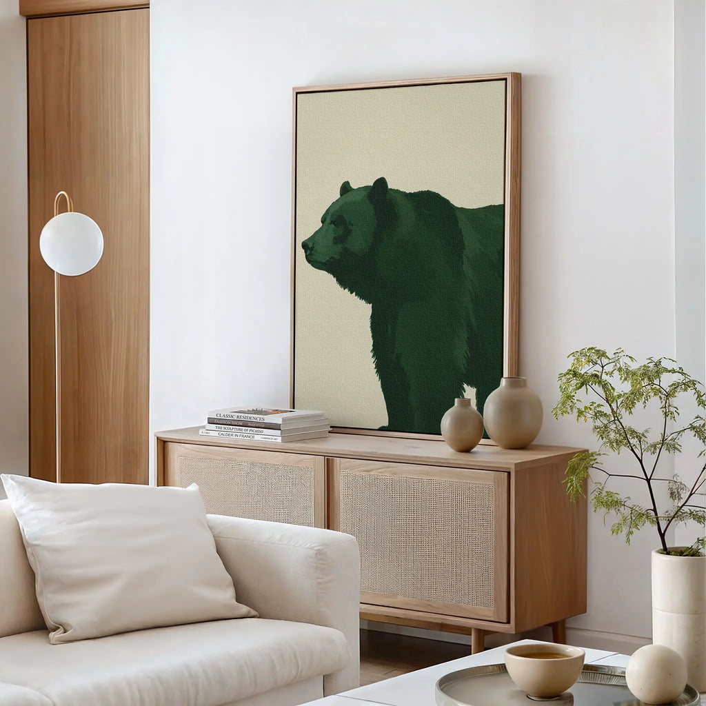 A modern living room with a light sofa, round coffee table, and sideboard topped with books and vases. Above the sideboard hangs the striking Forest Guardian Canvas Art. A potted plant brings a fresh touch to the stylish modern rustic decor.