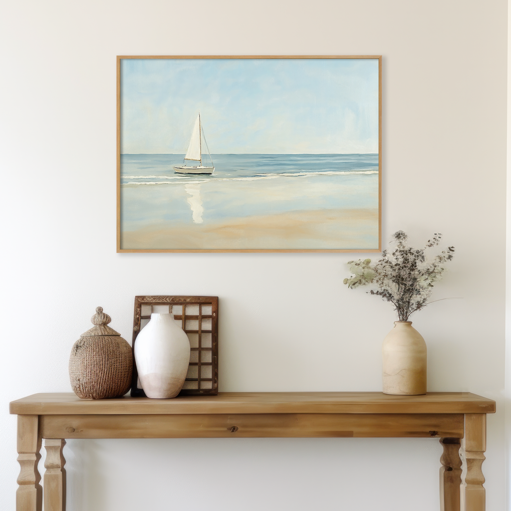 A wooden table with decorative vases and dried flowers sits by a light wall. Above, the Freedoms Call Canvas Art sailboat print adds a serene, coastal-inspired touch for tranquil home decor.