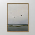 The Freeflight Canvas Art features a calm seascape with two birds soaring above gentle waves and a dark shoreline—a minimalist piece perfect for bringing serene style to your wall decor.