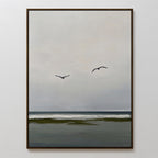 Freeflight Canvas Art features a minimalist seascape with two birds gliding above gentle waves and a dark shoreline under a gray sky—perfect for serene, uncluttered wall decor in any room.