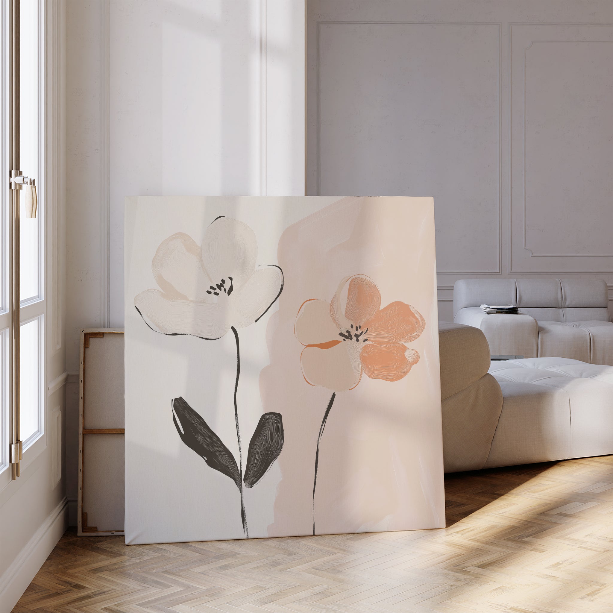 The Gentle Duo Canvas Art, featuring two abstract flowers in white and peach, leans against a wall in a bright living room with parquet floors and a white sofa, sunlight highlighting this minimalist floral artwork.