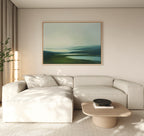 A light beige sectional and wooden coffee table with a black bowl pair beautifully with tall sheer curtains and the Gentle Valleys Canvas Art – Horizontal, a large landscape painting in blue and green tones that elevates tranquil living room decor.