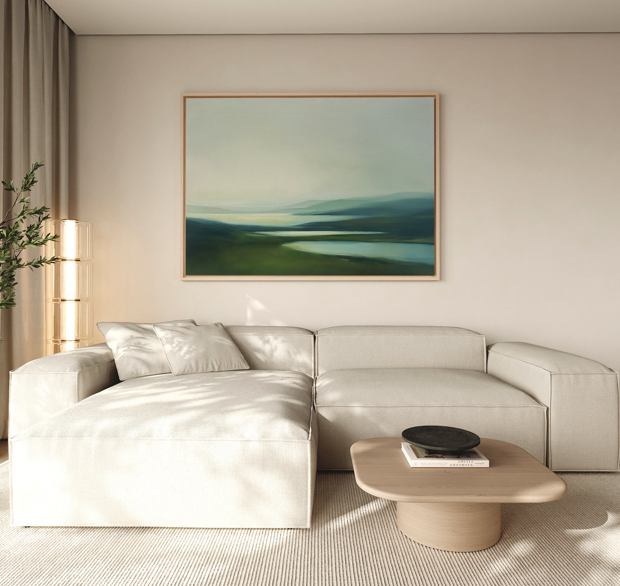 A light beige sectional and wooden coffee table with a black bowl pair beautifully with tall sheer curtains and the Gentle Valleys Canvas Art – Horizontal, a large landscape painting in blue and green tones that elevates tranquil living room decor.